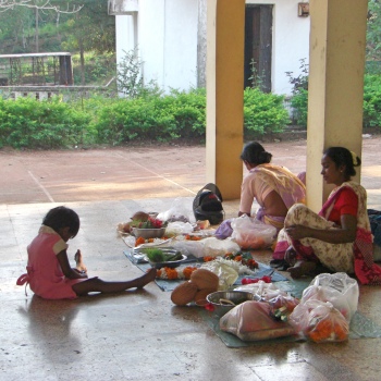 Making flower garlands at a temple in Goa
